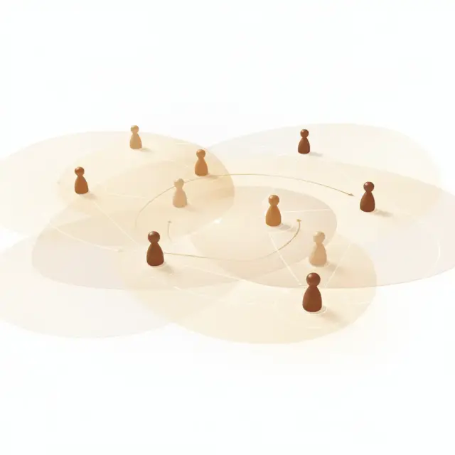 Holzspielfiguren in verschiedenen Farbtönen, angeordnet auf einer weißen Fläche mit sich überlappenden beigen Kreisen und verbindenden Pfeilen, die Netzwerk- oder soziale Verbindungen darstellen – eine ideale visuelle Metapher für das Vertriebstraining für Verkaufsteams, die die Bedeutung von Zusammenarbeit und strategischer Kommunikation innerhalb von Verkaufsteams hervorhebt.